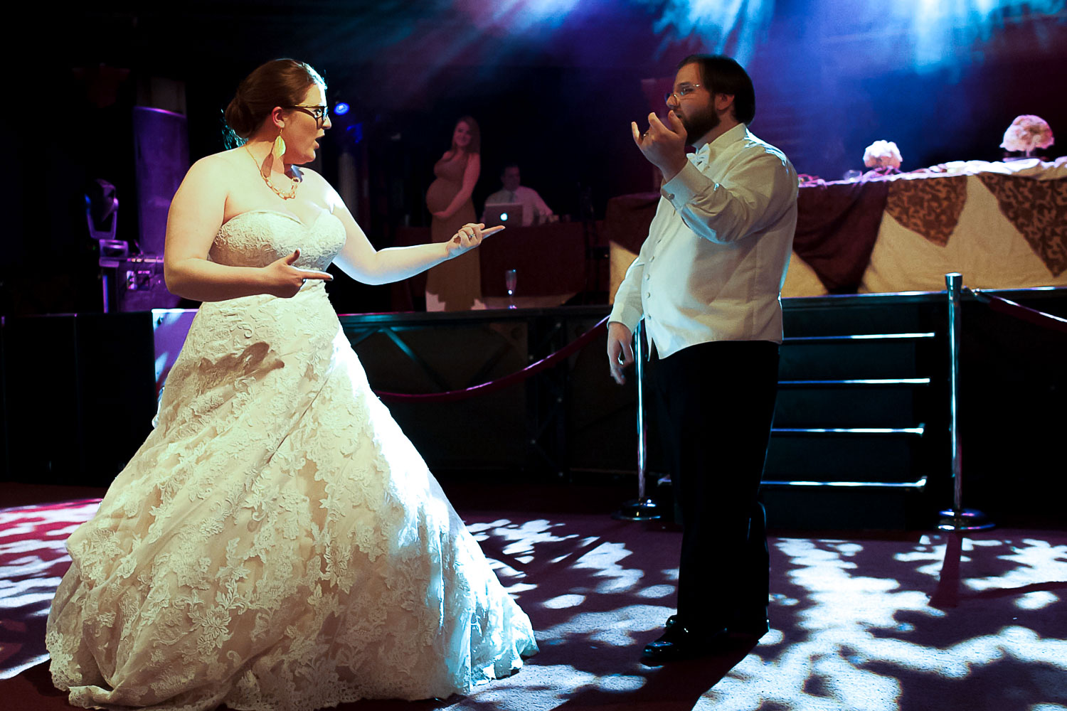 bride and groom playing the air guitar during their first dance at the Varsity in Minneapolis