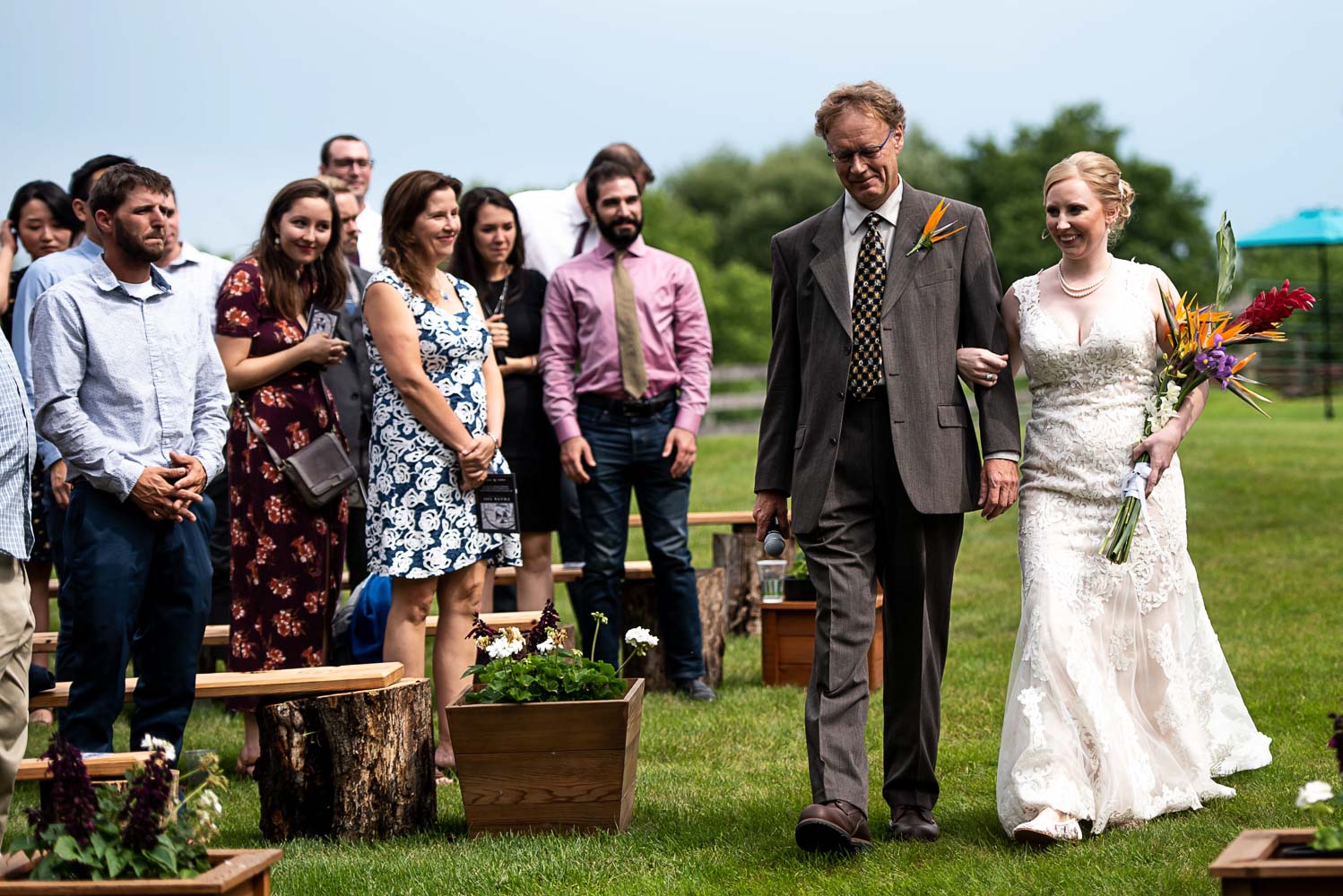 gorgeous bride walking down the aisle with her father
