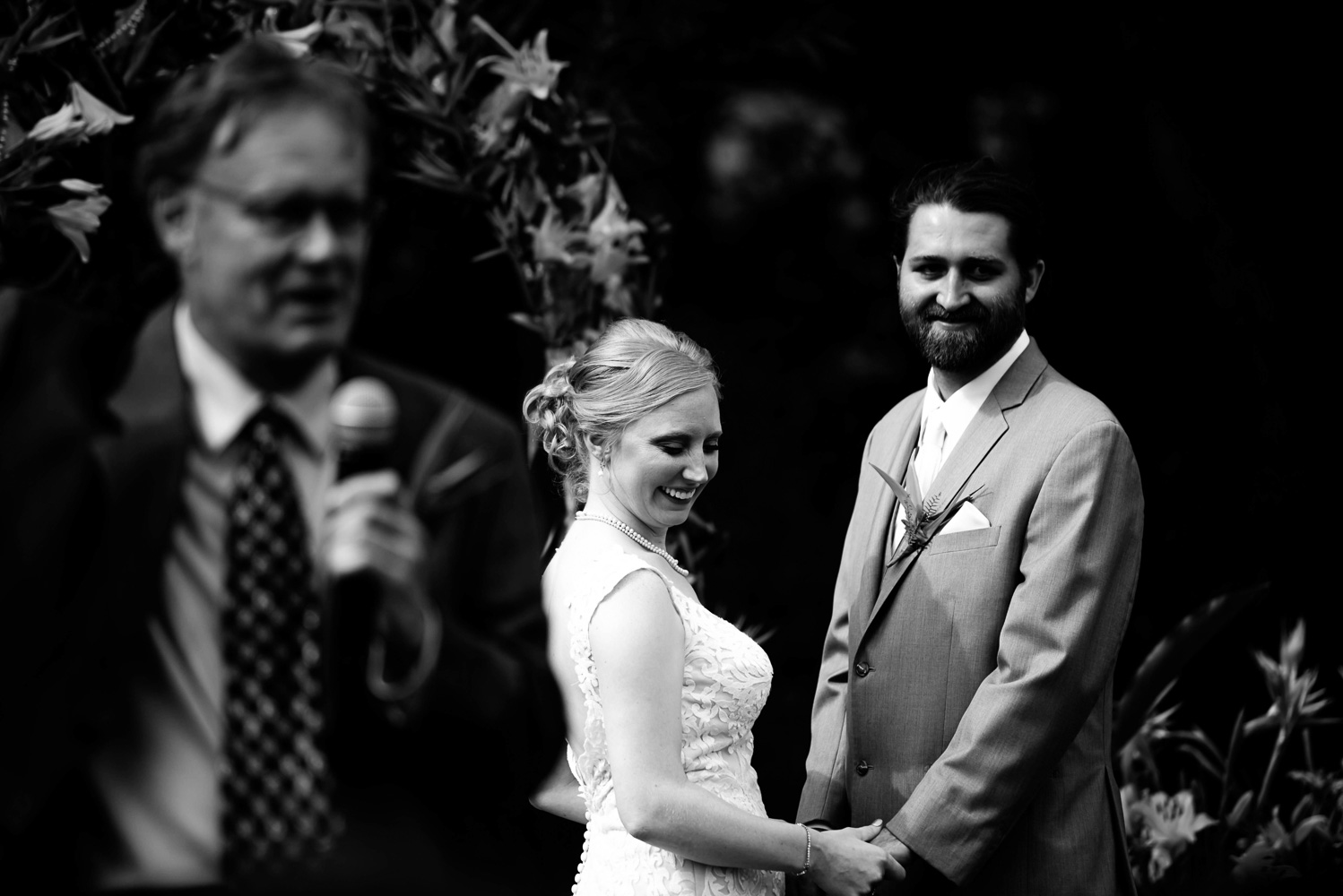 bride and groom holding hands during their wedding ceremony in Minnesota