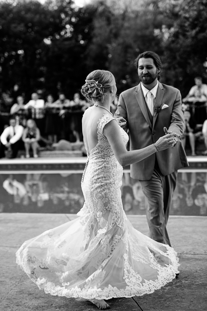 bride twirling in her wedding dress during the first dance