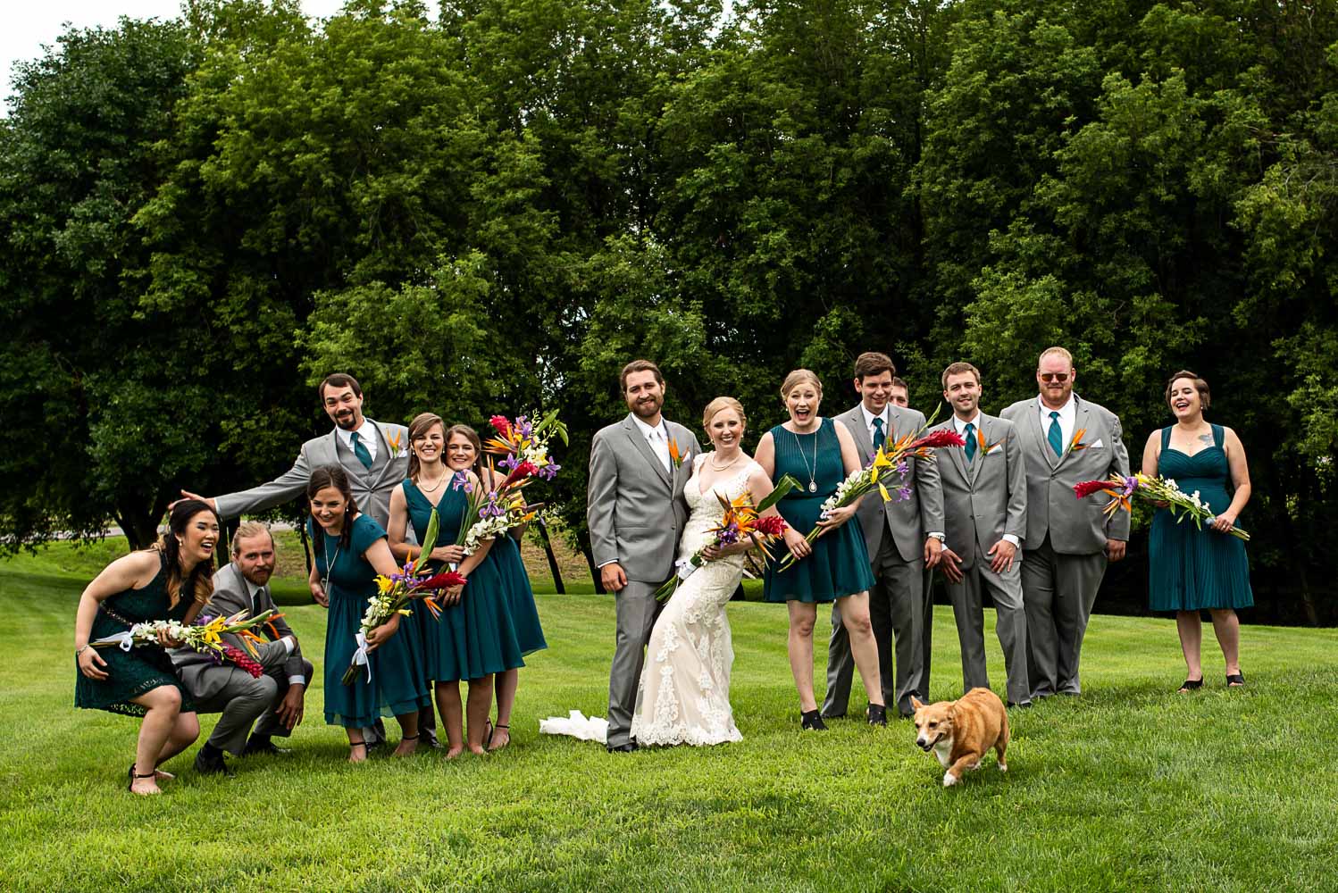 wedding party laughing together before the summer backyard wedding in Minnesota