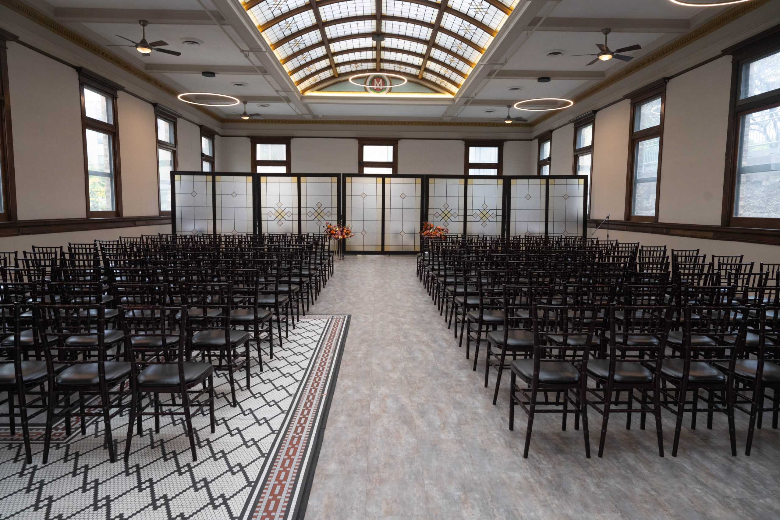 the interior of The 1893 at the Historic Grain Belt set up for a wedding ceremony