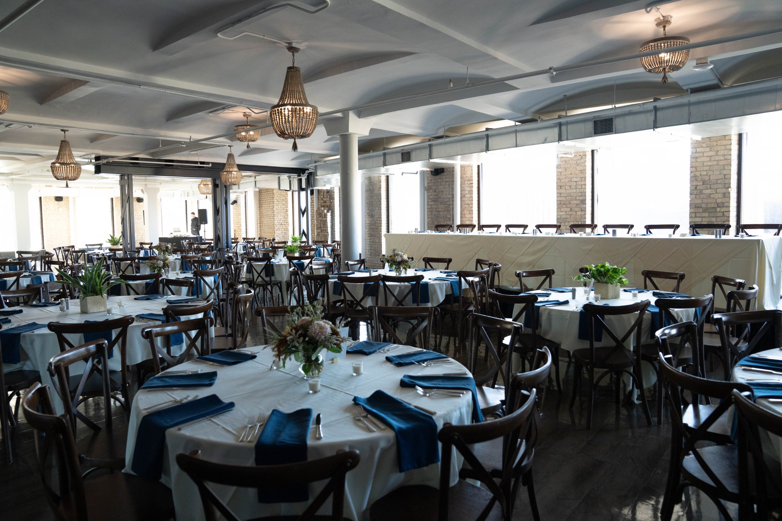 the interior of the Lumber Exchange Event Center set up for a wedding reception