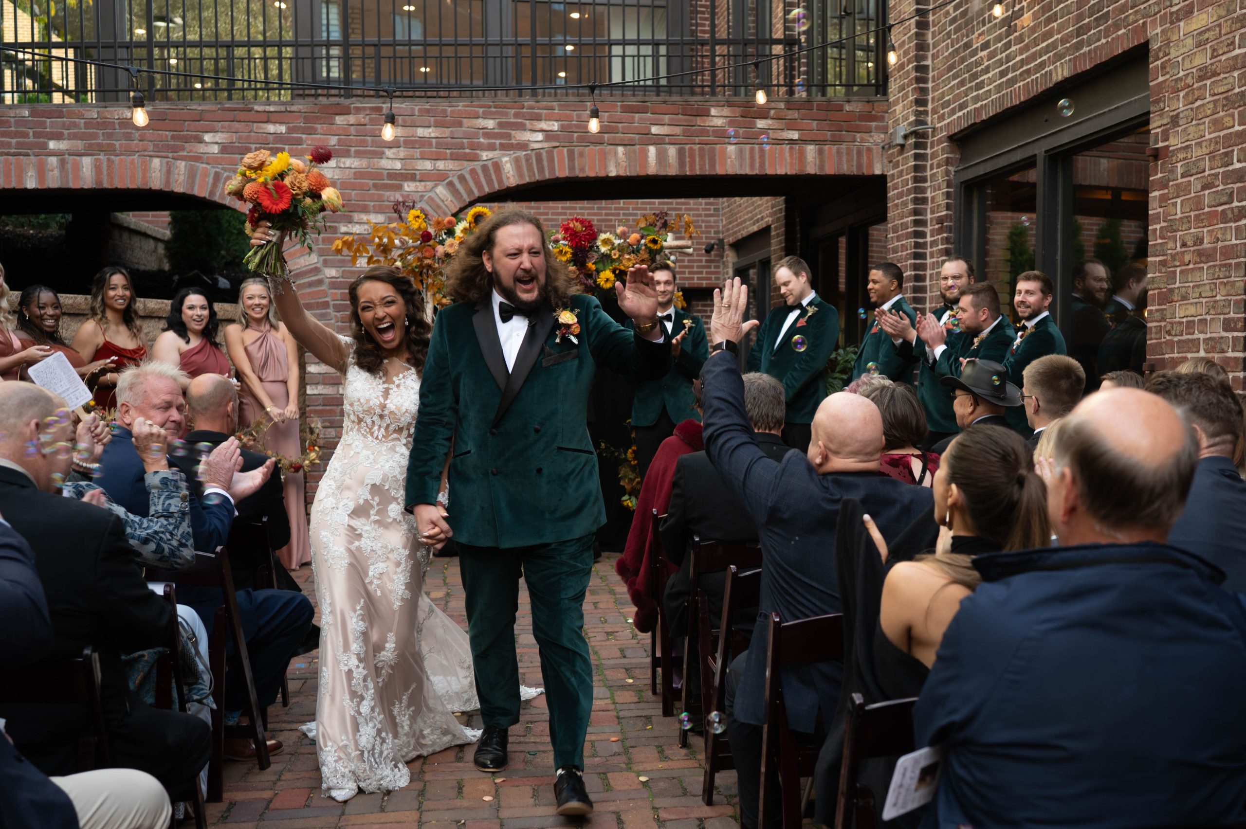 a couple walking down the aisle after their ceremony at minneapolis event center