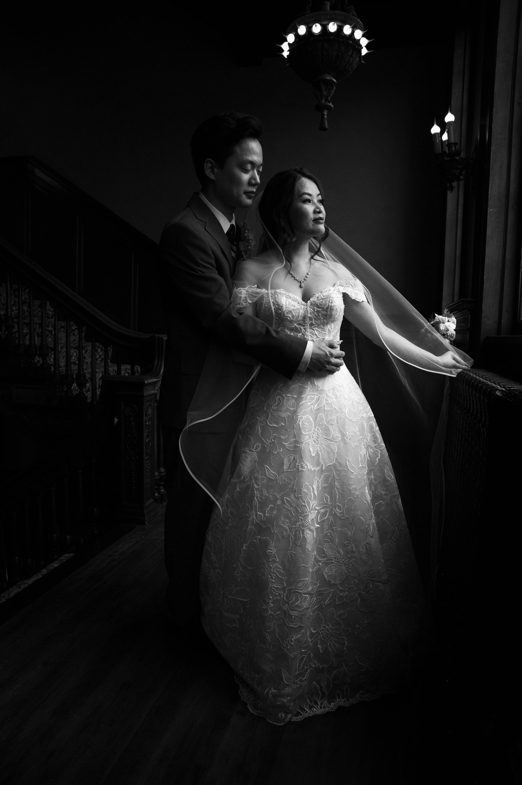 a couple taking wedding photos inside of semple mansion