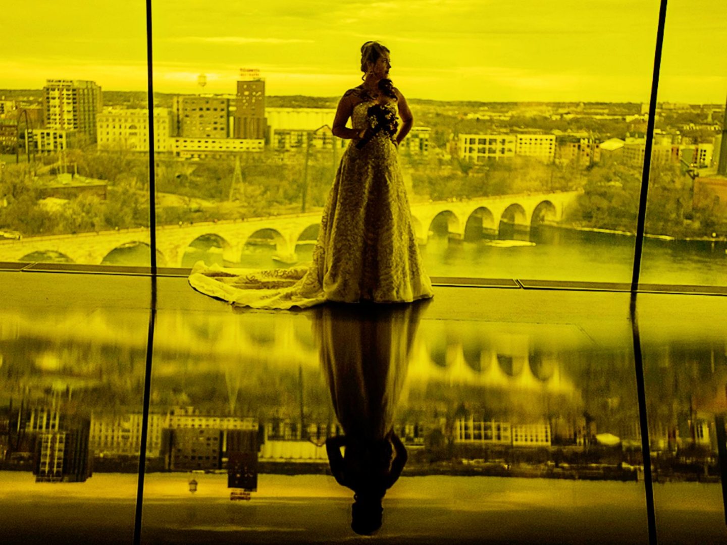 modern wedding venues minnesota 10 a bride taking a wedding portrait next to a window inside of the gutherie theater