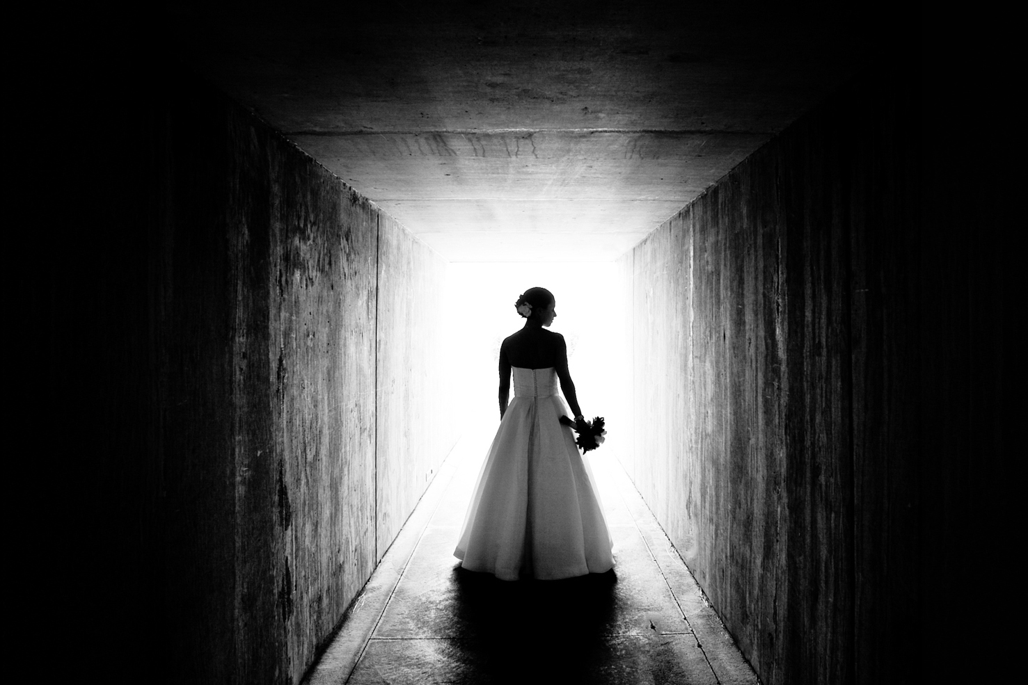 modern wedding venues minnesota 1 a woman in a wedding gown standing in a tunnel